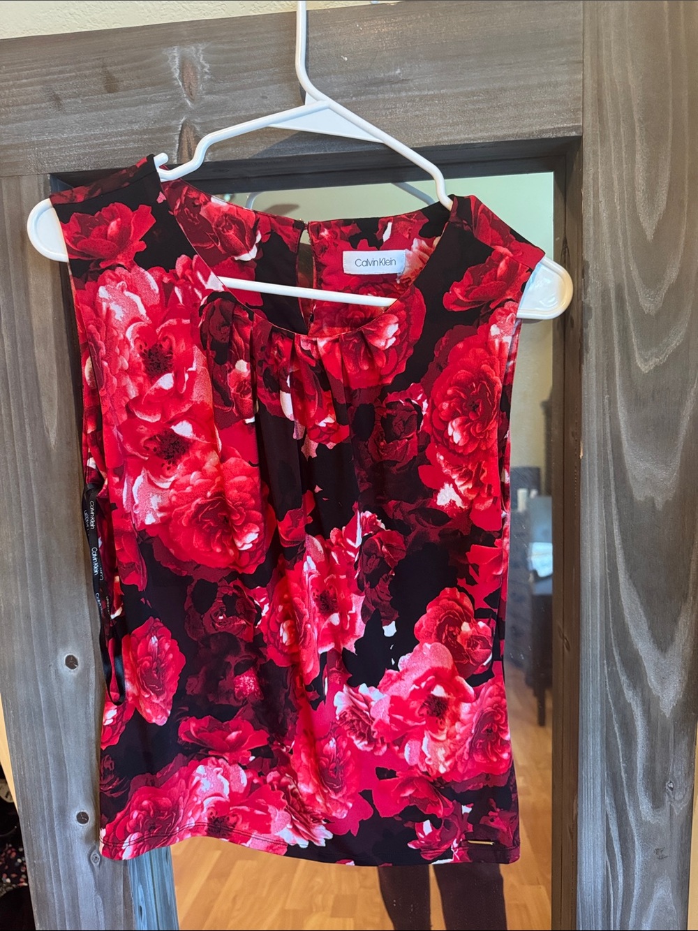 Calvin Klein Black Sleeveless Top with Bold Red Floral Print